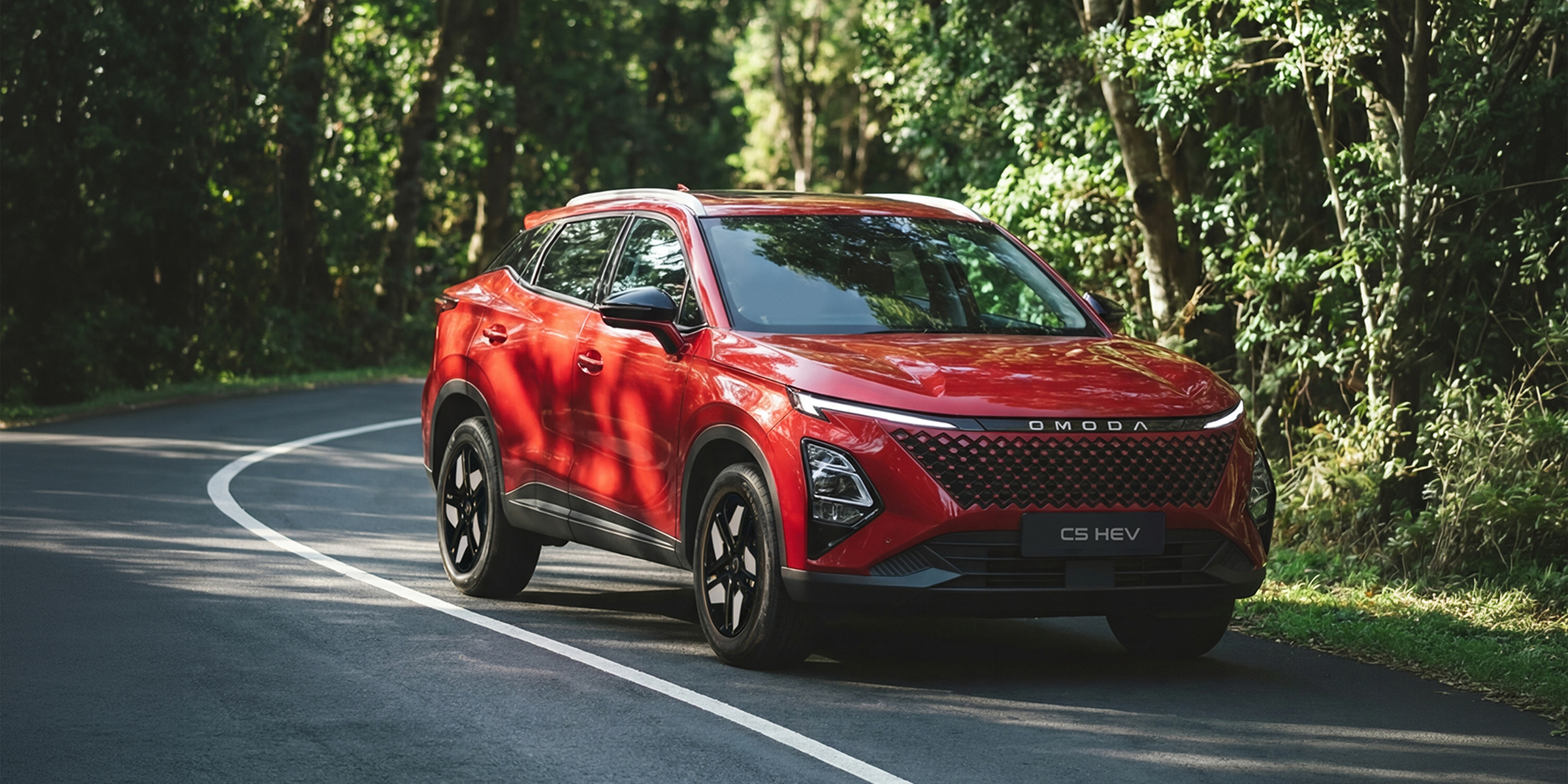 OMODA C5 SHS Hybrid driving on a forest road